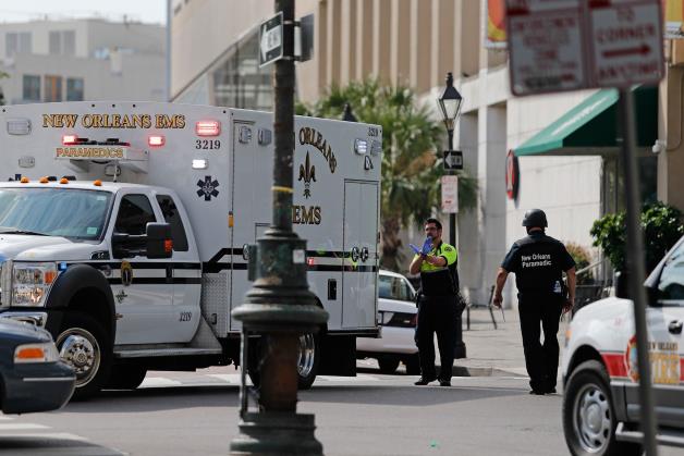 An ambulance pulls up to the Westin Hotel in New Orleans, Aug. 10.
