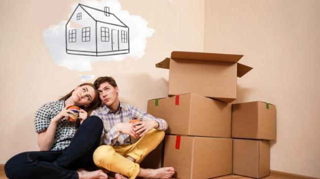 180831011553_young-couple-first-time-home-buyers-dreaming-with-boxes.jpg